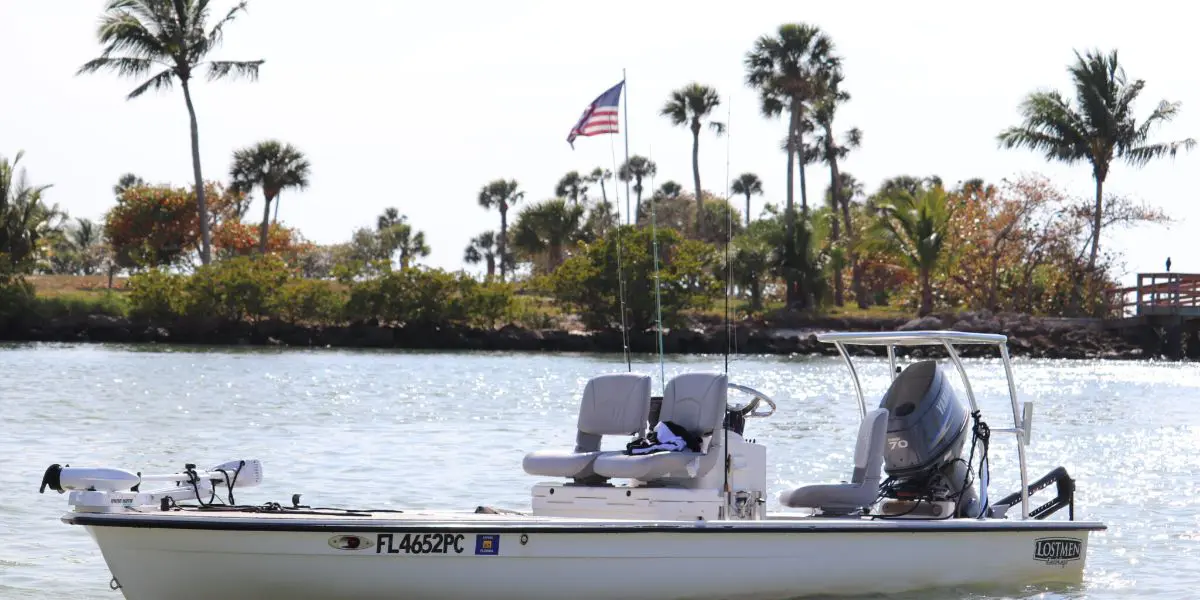 A boat with two people in it on the water.